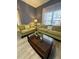 Comfortable living room with large window and coffee table featuring modern vinyl flooring at 8973 Cat Palm Rd, Kissimmee, FL 34747