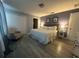 Spacious main bedroom features a queen bed, armchair, and ample closet space at 8973 Cat Palm Rd, Kissimmee, FL 34747