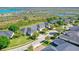 Aerial view of complex near a lake surrounded by vegetation at 1017 Green Gate Blvd, Groveland, FL 34736
