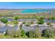 Wide angle aerial view of complex near a lake and natural area at 1017 Green Gate Blvd, Groveland, FL 34736