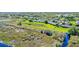 Aerial view of complex near a natural area with walkways and a dock at 1017 Green Gate Blvd, Groveland, FL 34736