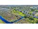 Wide angle aerial view of complex with a dock in a natural area at 1017 Green Gate Blvd, Groveland, FL 34736
