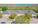 An aerial view of charming townhomes featuring attached garages and well maintained landscaping at 1017 Green Gate Blvd, Groveland, FL 34736