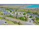 Aerial view of complex close to a long lake at 1017 Green Gate Blvd, Groveland, FL 34736