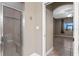 Bathroom with tile surround shower and glass door, next to the bedroom entrance at 1017 Green Gate Blvd, Groveland, FL 34736