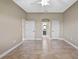Spacious bedroom with tiled floor, doors to hall and bath, and neutral paint at 1017 Green Gate Blvd, Groveland, FL 34736