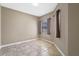 Cozy bedroom with ceramic tile flooring, a window with nice blinds, providing a simple retreat at 1017 Green Gate Blvd, Groveland, FL 34736