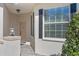 Welcoming villa entrance featuring a stylish door, accent lighting, and neat landscaping, creating a pleasant first impression at 1017 Green Gate Blvd, Groveland, FL 34736