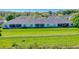 Long view of a unit with a well maintained lawn at 1017 Green Gate Blvd, Groveland, FL 34736