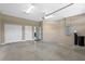 Spacious two car garage with neutral colored walls, overhead lighting, and white doors at 1017 Green Gate Blvd, Groveland, FL 34736