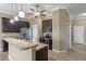 Kitchen with dark cabinets, granite countertops, and stainless steel appliances at 1017 Green Gate Blvd, Groveland, FL 34736