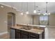 Kitchen featuring a breakfast bar with sink and stainless steel dishwasher at 1017 Green Gate Blvd, Groveland, FL 34736
