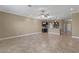 Spacious living area open to the kitchen featuring tile floors at 1017 Green Gate Blvd, Groveland, FL 34736