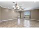 Open-concept living room featuring tiled flooring and natural light at 1017 Green Gate Blvd, Groveland, FL 34736