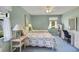 Inviting bedroom featuring two twin beds, a desk, and comfortable blue carpet at 1033 Scotch Pine Ct, Leesburg, FL 34788