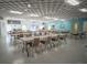 The large common room offers plenty of space for tables and chairs at 1033 Scotch Pine Ct, Leesburg, FL 34788