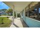 Covered front porch with ample space, offering a welcoming entrance to the home at 1033 Scotch Pine Ct, Leesburg, FL 34788