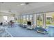 Bright sunroom with floor-to-ceiling windows offering lovely views of the outdoors at 1033 Scotch Pine Ct, Leesburg, FL 34788
