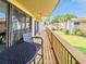 Inviting balcony features outdoor seating and a beautiful view of the community's well-maintained greenery and surrounding buildings at 1051 S Highland St # 7E, Mount Dora, FL 32757