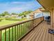 Enjoy serene views of the community pool and lush landscaping from this spacious balcony, perfect for relaxation and outdoor dining at 1051 S Highland St # 7E, Mount Dora, FL 32757