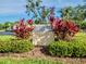 Bunker Hill Condominiums community sign with tropical landscaping at 1051 S Highland St # 7E, Mount Dora, FL 32757