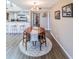 Cozy dining area with a stylish table and view of the modern kitchen at 1051 S Highland St # 7E, Mount Dora, FL 32757