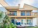 Multi-level condo with balconies and private patios, surrounded by lush greenery at 1051 S Highland St # 7E, Mount Dora, FL 32757