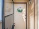 Inviting entryway with a wreath-adorned door and modern design elements at 1051 S Highland St # 7E, Mount Dora, FL 32757