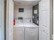 Convenient laundry room with a washer and dryer hook ups at 1051 S Highland St # 7E, Mount Dora, FL 32757