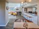 Bright and open living space featuring a modern kitchen and stylish furniture at 1051 S Highland St # 7E, Mount Dora, FL 32757