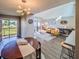 Inviting living and dining areas with views of the balcony and stylish decor at 1051 S Highland St # 7E, Mount Dora, FL 32757