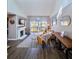 Bright living room with fireplace, balcony access, and stylish decor at 1051 S Highland St # 7E, Mount Dora, FL 32757
