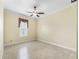 Neutral bedroom with tile floors, window with valance and ceiling fan at 10929 Se 167Th Pl, Summerfield, FL 34491