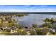 A scenic lake neighborhood with homes featuring docks, boat lifts, and waterfront access at 11007 Lake Katherine Cir, Clermont, FL 34711