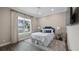 Bedroom with a queen bed and a lake view from the bright window at 11007 Lake Katherine Cir, Clermont, FL 34711