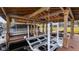 Pontoon boat in lift, providing convenient lake access and storage at this waterfront property at 11007 Lake Katherine Cir, Clermont, FL 34711