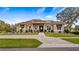 Charming front exterior with a paved driveway, manicured landscaping, and inviting entrance at 11007 Lake Katherine Cir, Clermont, FL 34711