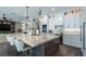 Spacious kitchen with large island, modern appliances, and stylish pendant lighting at 11007 Lake Katherine Cir, Clermont, FL 34711