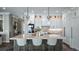 Well-appointed kitchen with marble counters, island seating, and sleek, modern finishes at 11007 Lake Katherine Cir, Clermont, FL 34711
