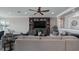 Inviting living room featuring a built-in entertainment center and comfortable, neutral-toned furniture at 11007 Lake Katherine Cir, Clermont, FL 34711