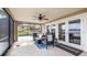 Covered patio with comfortable seating and a pool, overlooking the lake at 11007 Lake Katherine Cir, Clermont, FL 34711