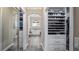 Spacious walk-in closet with custom shelving, ample storage, and convenient access to the bathroom at 11007 Lake Katherine Cir, Clermont, FL 34711