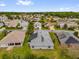 Community aerial view featuring homes with solar panels and mature landscaping at 11396 Se 178Th Pl, Summerfield, FL 34491