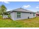 Spacious backyard with green grass and a white fence at 11396 Se 178Th Pl, Summerfield, FL 34491