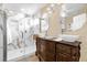 Elegant bathroom with marble walk-in shower, vessel sinks and ornate vanity at 11396 Se 178Th Pl, Summerfield, FL 34491