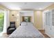 Inviting bedroom with a comfortable recliner, a full-size murphy bed, and a minimalist design, ideal for relaxation at 11396 Se 178Th Pl, Summerfield, FL 34491