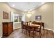 Formal dining room boasting hardwood floors, recessed lighting, and a chandelier at 11396 Se 178Th Pl, Summerfield, FL 34491