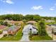Charming single-story home featuring an attached two-car garage and a beautifully landscaped front yard at 11396 Se 178Th Pl, Summerfield, FL 34491