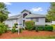Charming single-story home with manicured landscaping and a well-maintained front yard at 11396 Se 178Th Pl, Summerfield, FL 34491