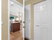 Hallway view into open-concept kitchen with island and seating at 11396 Se 178Th Pl, Summerfield, FL 34491